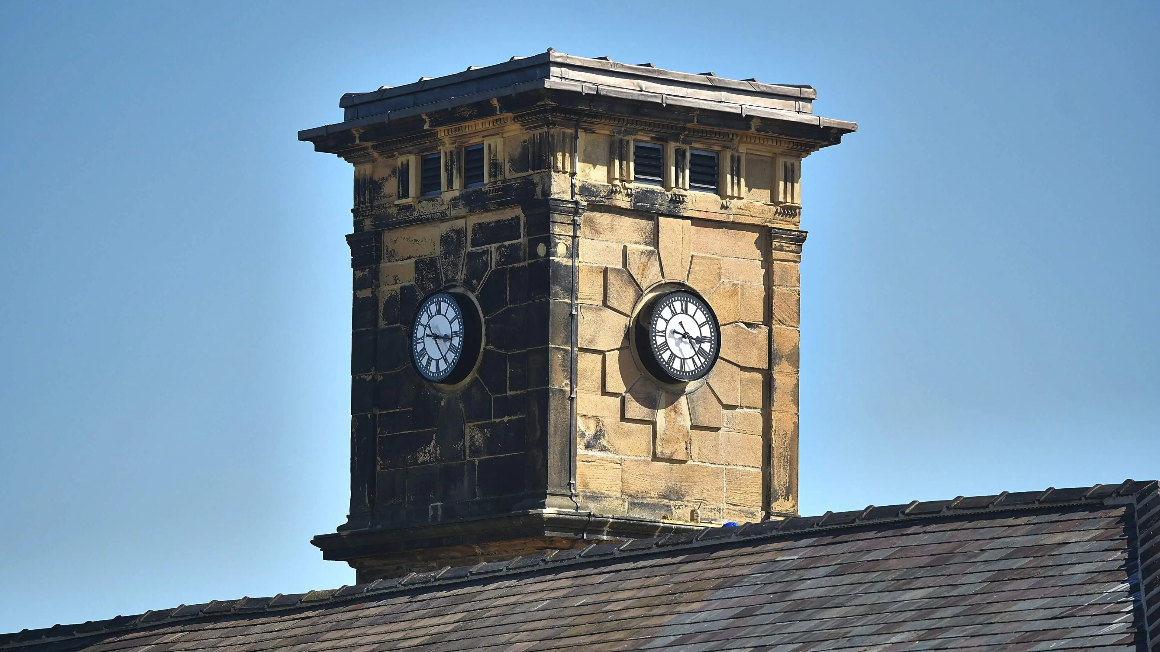Old clocktower with new clock faces