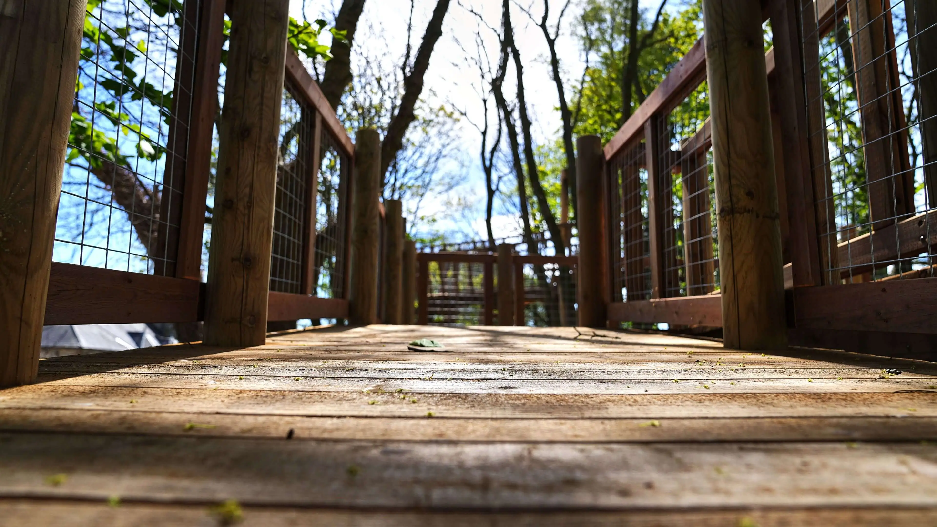 A wooden walkway in a playpark